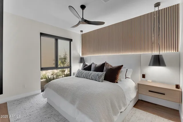 a bedroom with a large bed and a window