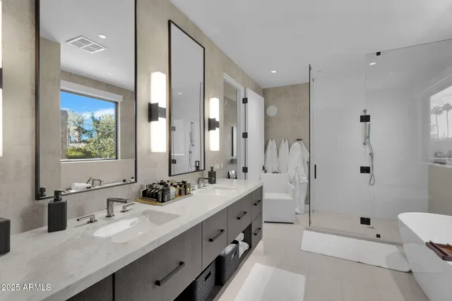 a bathroom with a double vanity sink mirror double and shower