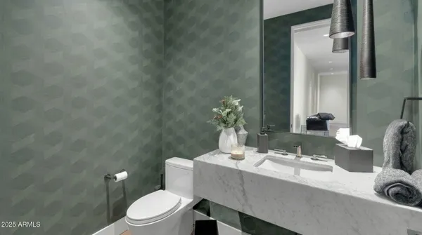 a utility room with sink dryer and washer