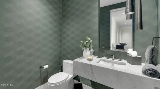 a utility room with sink dryer and washer