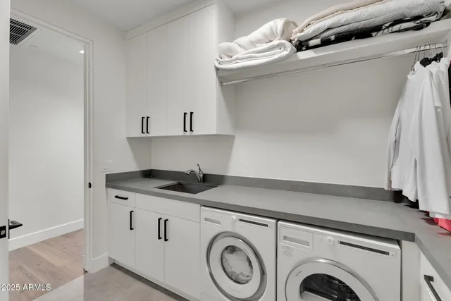 a kitchen with granite countertop a sink a stove and cabinets