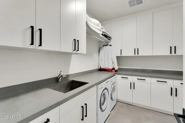 a view of a patio with couches table and chairs and potted plants