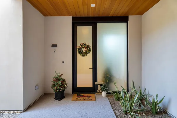 a building outdoor space with patio couch and a potted plant