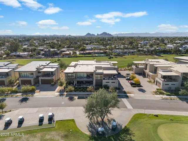 an aerial view of a house with a lake view
