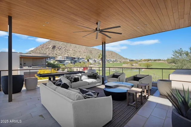 a view of a couches and lounge chairs