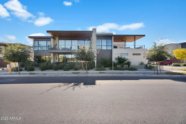 a view of a house with a street