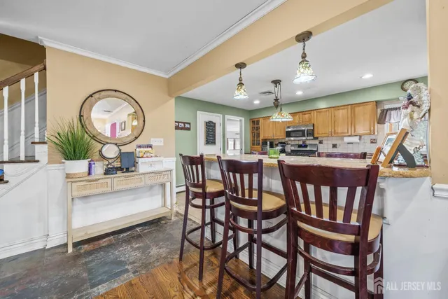 a kitchen with stainless steel appliances granite countertop a sink counter space and cabinets