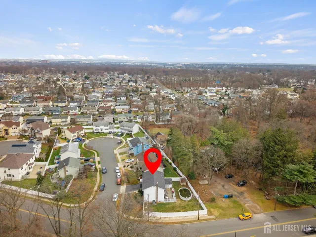 an aerial view of residential building with trees