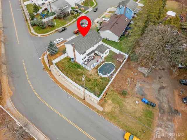 a kitchen with stainless steel appliances kitchen island granite countertop a table and chairs in it