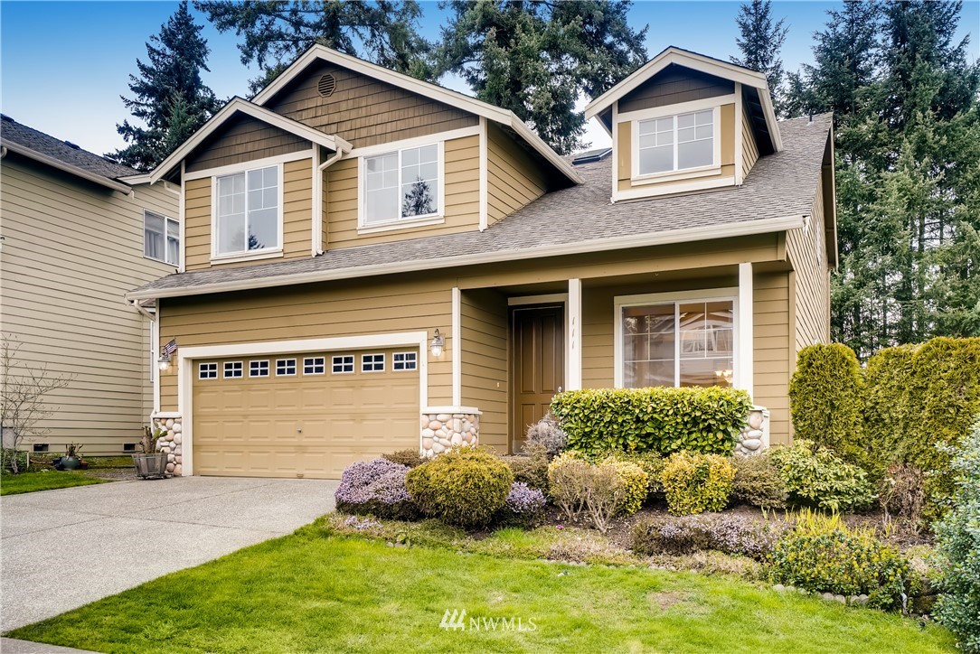 111 203rd Street Southeast Bothell, WA 98012 - Photo 1 of 31 a front view of a house with garden