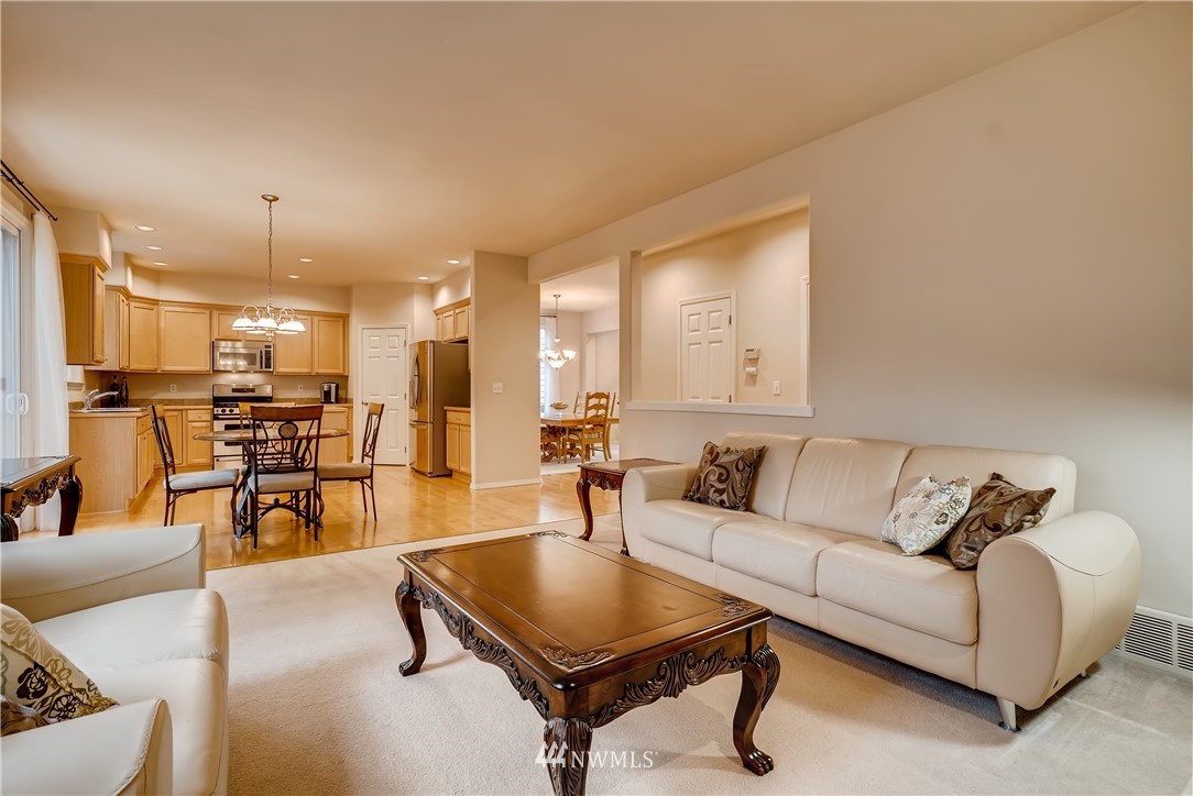 111 203rd Street Southeast Bothell, WA 98012 - Photo 14 of 31 a living room with furniture a table and kitchen view