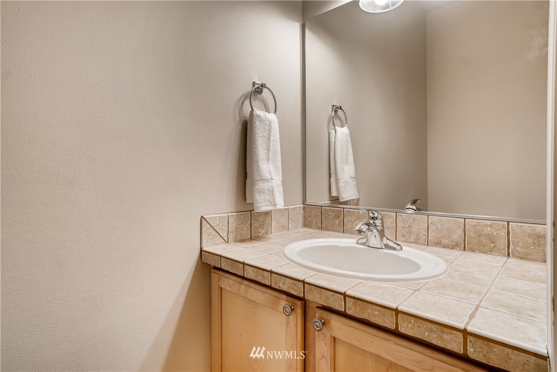 111 203rd Street Southeast Bothell, WA 98012 - Photo 16 of 31 a bathroom with a sink and a mirror