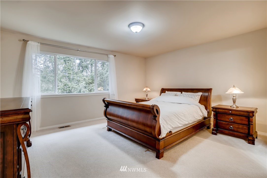 111 203rd Street Southeast Bothell, WA 98012 - Photo 17 of 31 a bed sitting in a bedroom next to a window