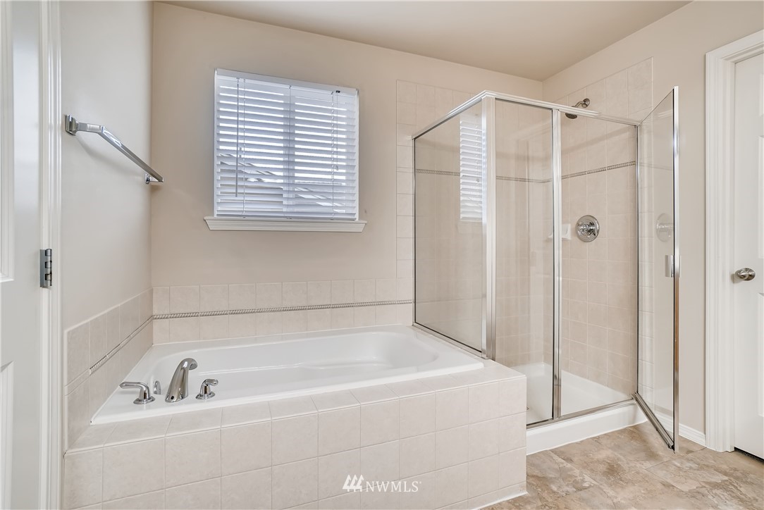 111 203rd Street Southeast Bothell, WA 98012 - Photo 20 of 31 a bathroom with a bathtub and a shower
