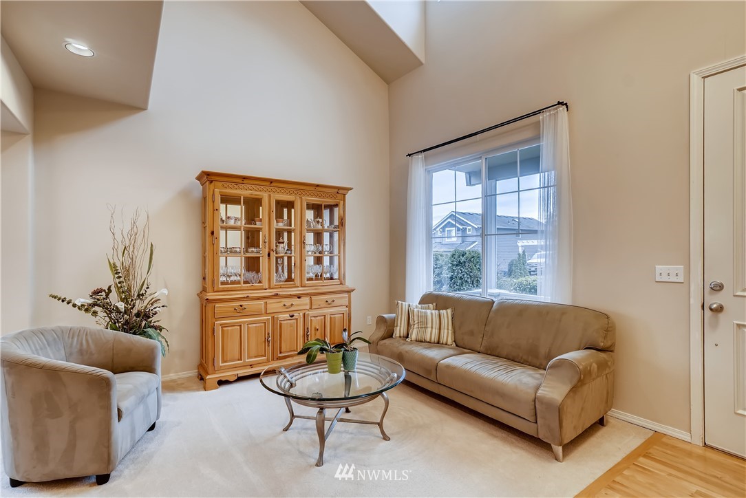 111 203rd Street Southeast Bothell, WA 98012 - Photo 6 of 31 a living room with furniture and a large window