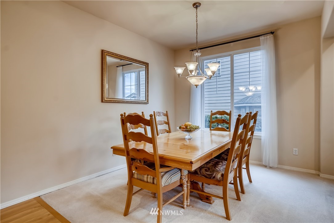 111 203rd Street Southeast Bothell, WA 98012 - Photo 7 of 31 a view of a dining room with furniture and window