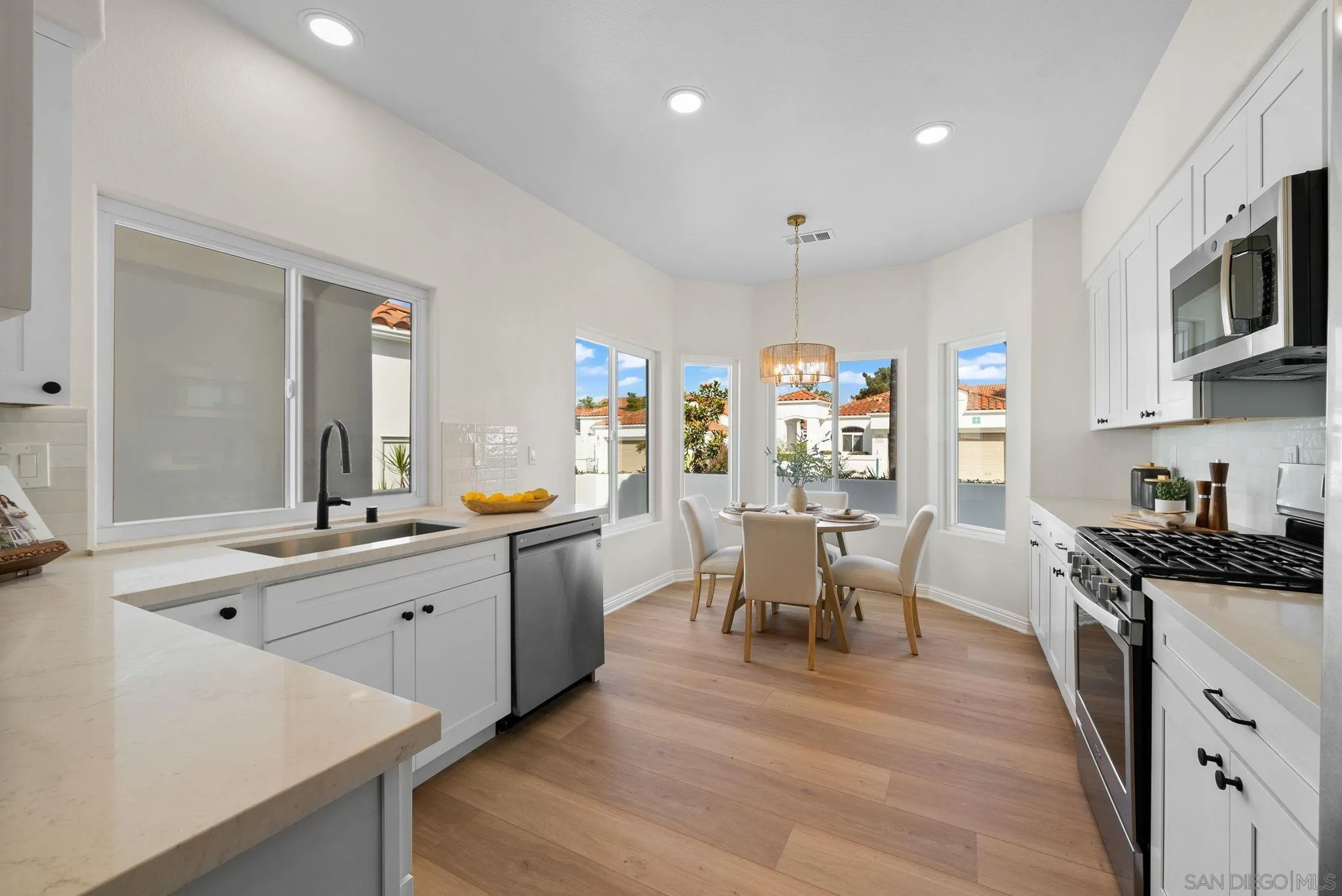 4957 Lamia Way Oceanside, CA 92056 - Photo 11 of 31 a large kitchen with lots of counter space and stainless steel appliances