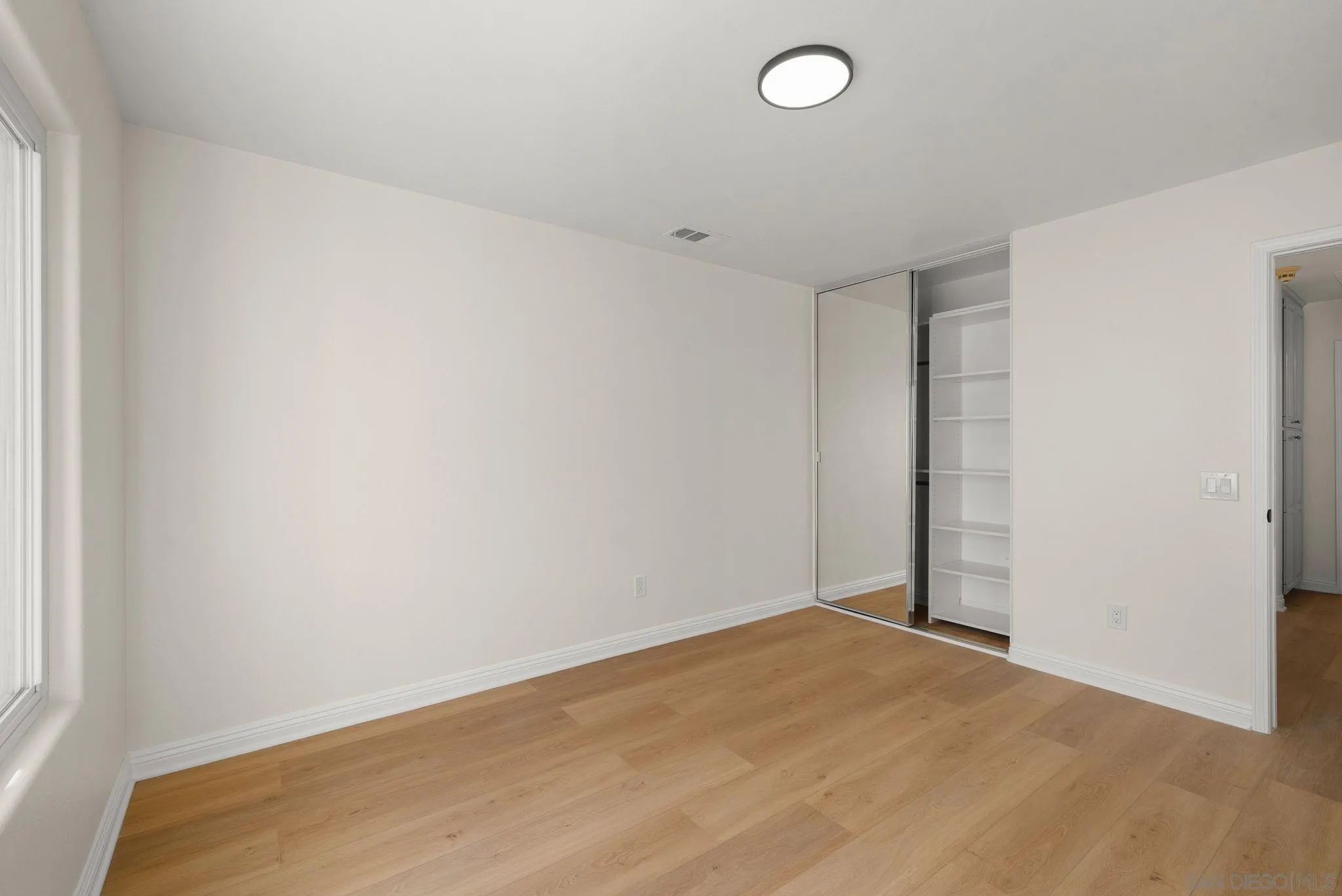 4957 Lamia Way Oceanside, CA 92056 - Photo 15 of 31 an empty room with a empty space and a window