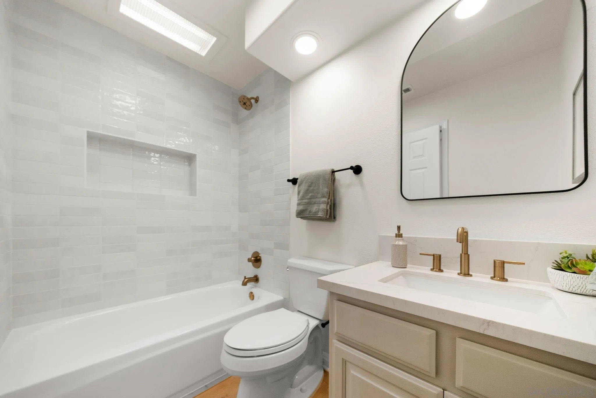 4957 Lamia Way Oceanside, CA 92056 - Photo 16 of 31 a bathroom with a sink a toilet and a mirror