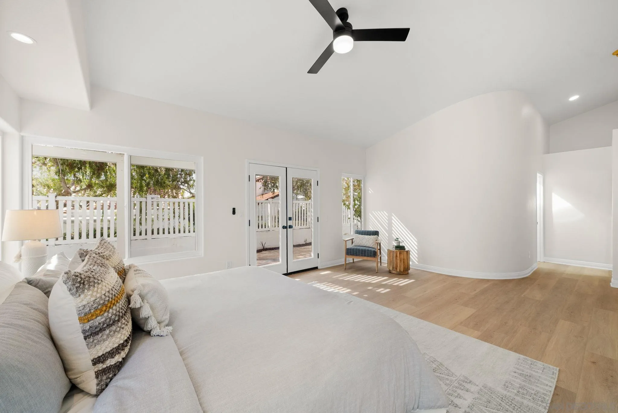 4957 Lamia Way Oceanside, CA 92056 - Photo 18 of 31 a bedroom with a bed and a window