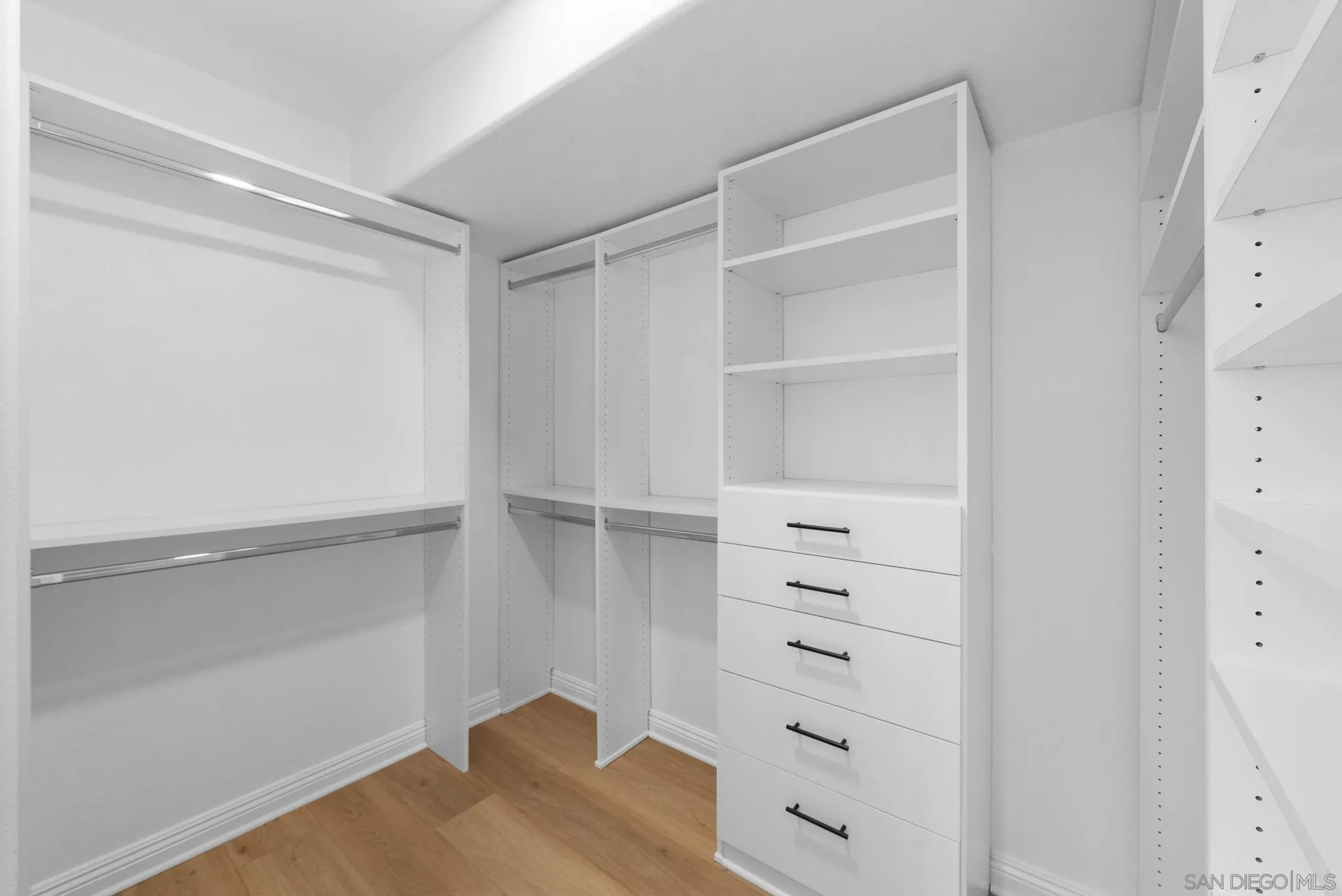 4957 Lamia Way Oceanside, CA 92056 - Photo 19 of 31 a view of walk in closet with empty racks