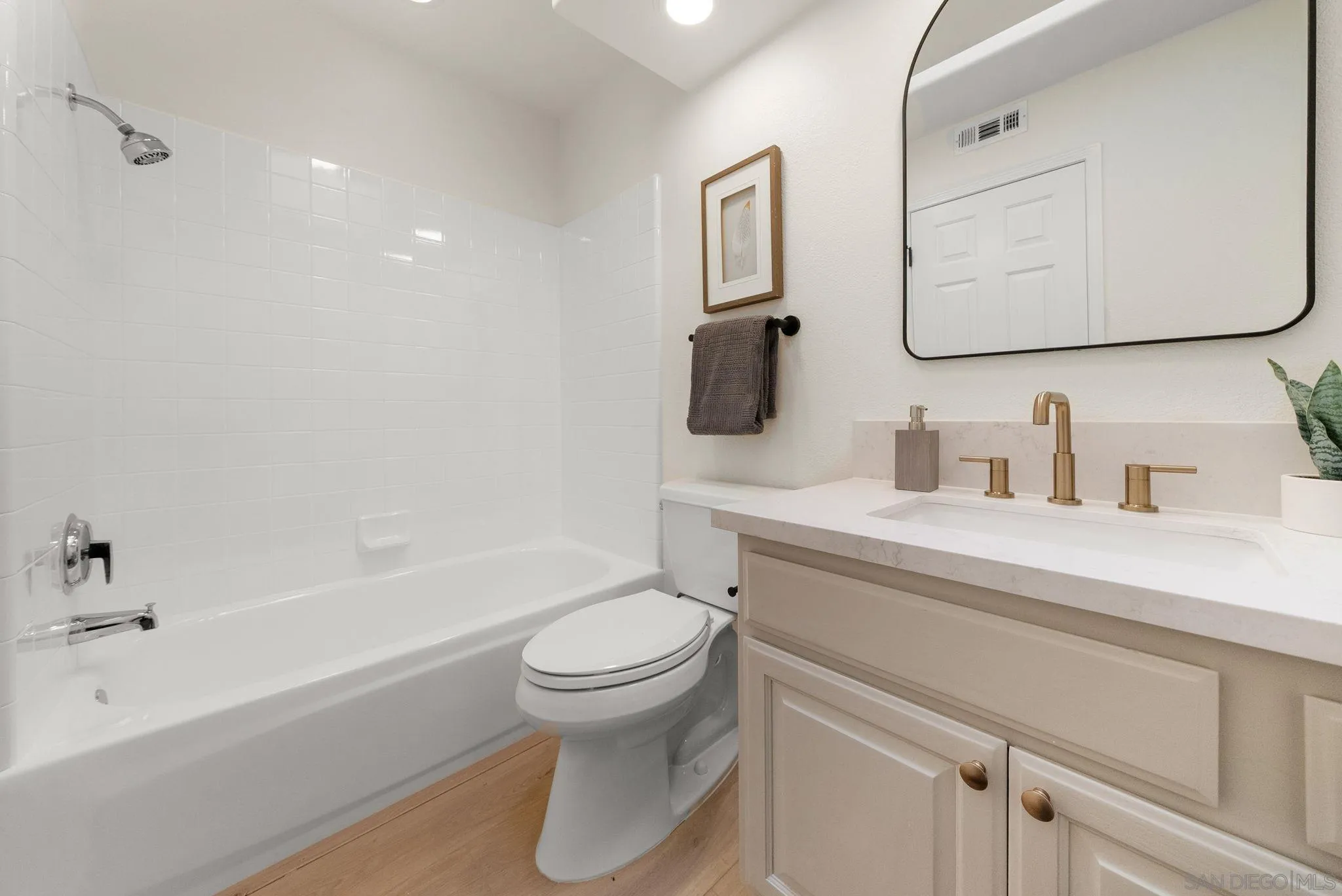 4957 Lamia Way Oceanside, CA 92056 - Photo 24 of 31 a bathroom with a sink toilet and shower
