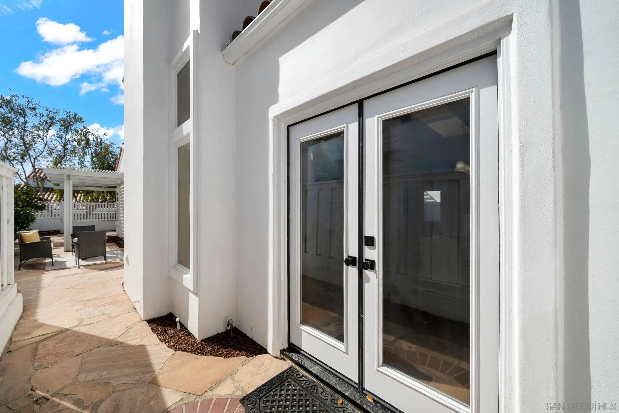 4957 Lamia Way Oceanside, CA 92056 - Photo 26 of 31 a bathroom with a glass door and shower