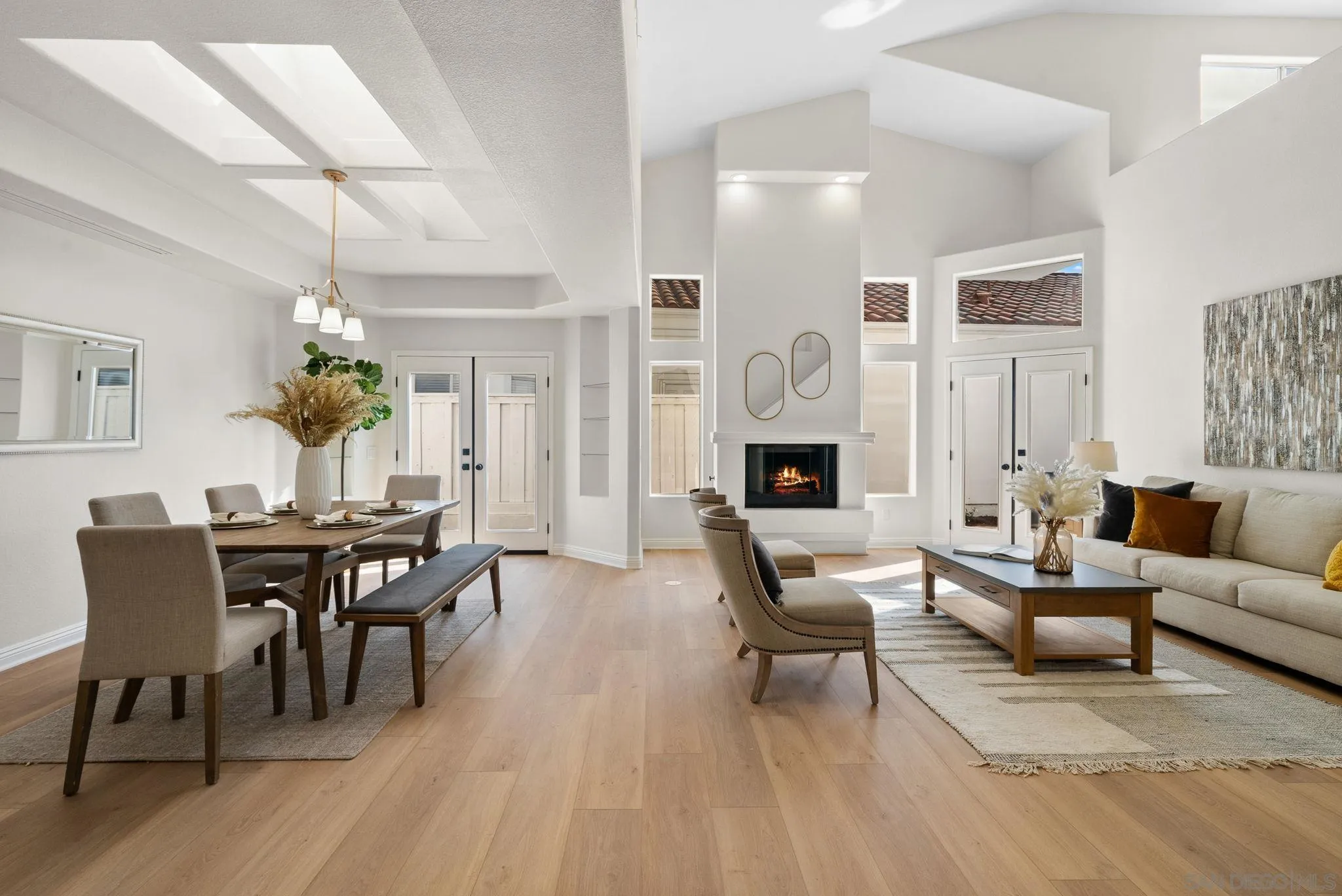 4957 Lamia Way Oceanside, CA 92056 - Photo 4 of 31 a living room with furniture dining table a table and a chandelier