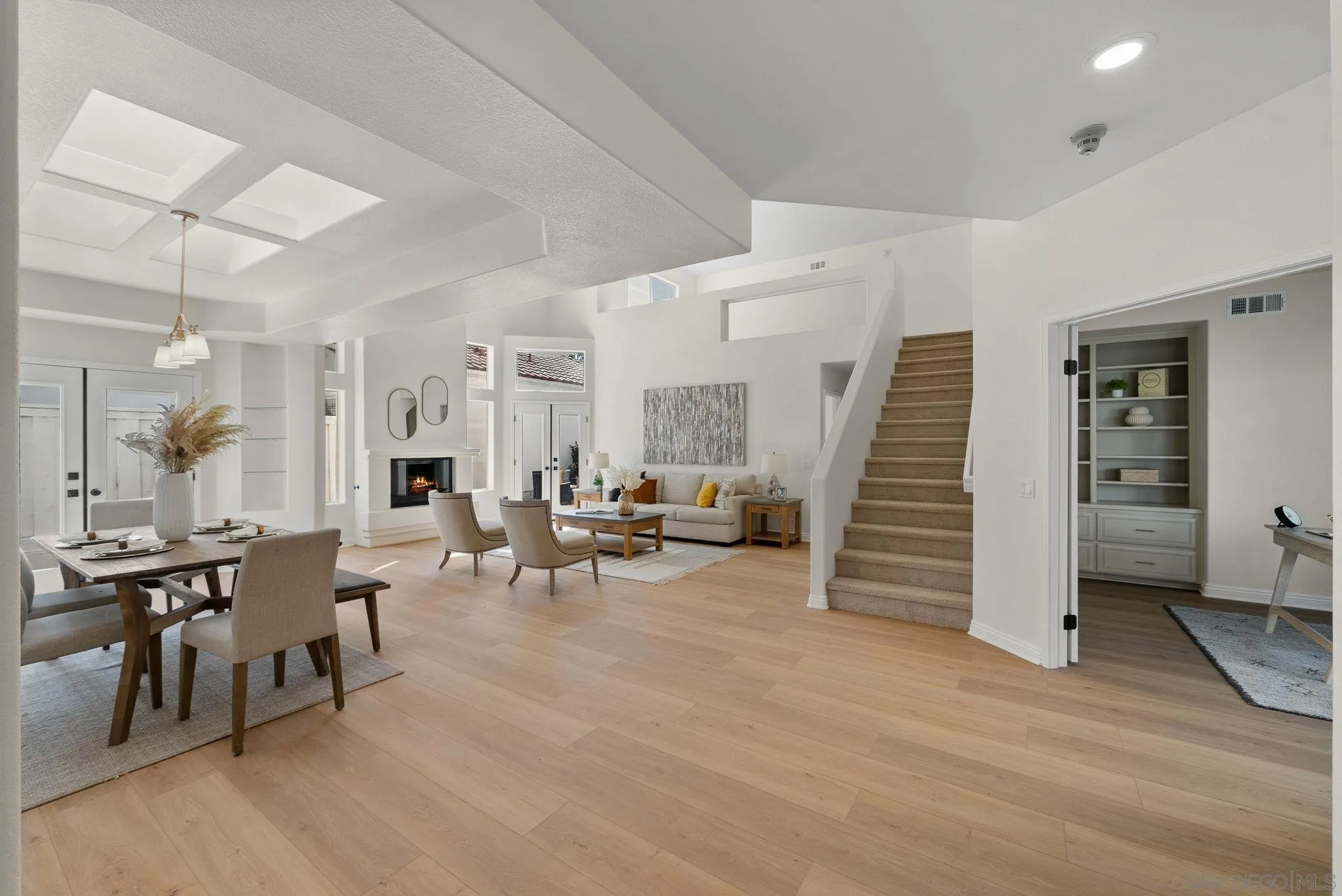 4957 Lamia Way Oceanside, CA 92056 - Photo 5 of 31 a living room with furniture and wooden floor