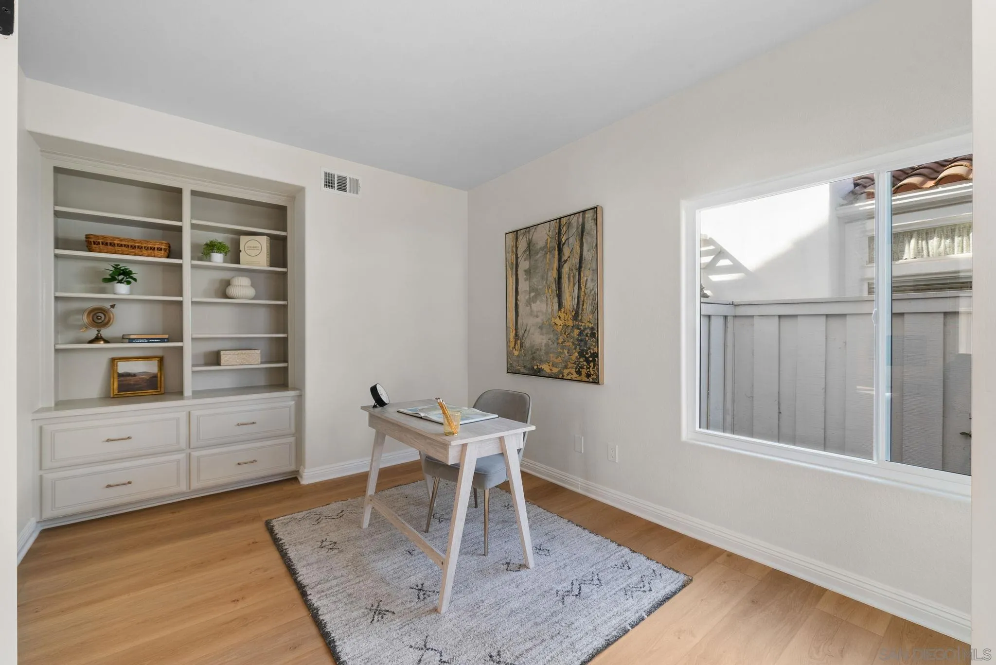 4957 Lamia Way Oceanside, CA 92056 - Photo 10 of 31 a living room with furniture a rug and a window