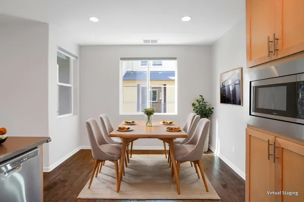 a dining room with furniture and window