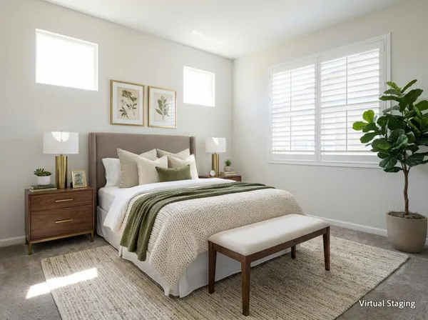 a bedroom with a bed and a potted plant