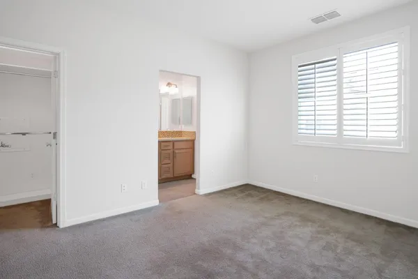 a bedroom with a bed and a table in it