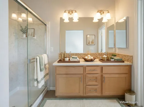 a bathroom with a sink a large mirror and a shower