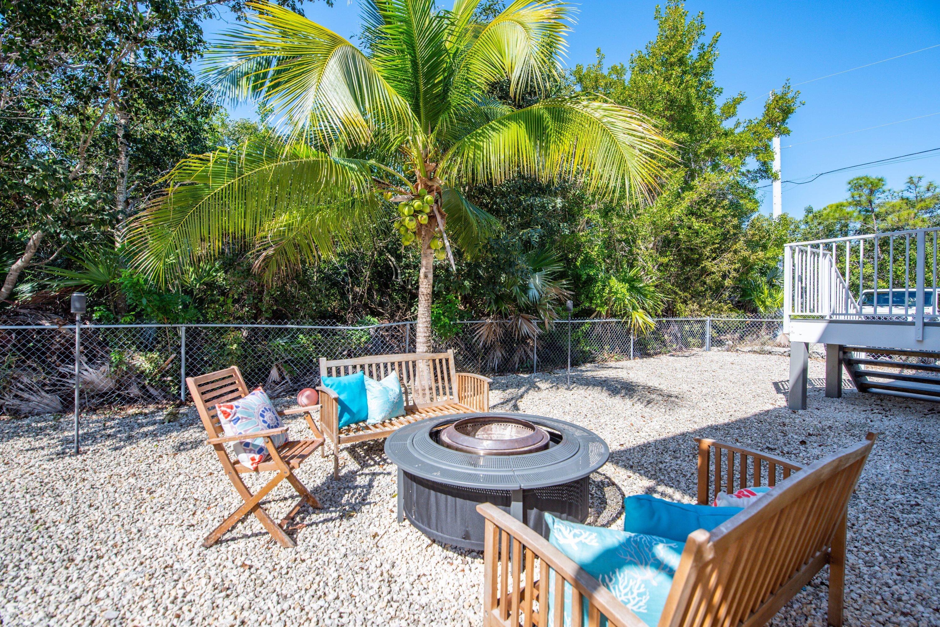29160 Primrose Lane Big Pine Key, FL 33043 - Photo 12 of 37 a view of a chairs and table in the patio
