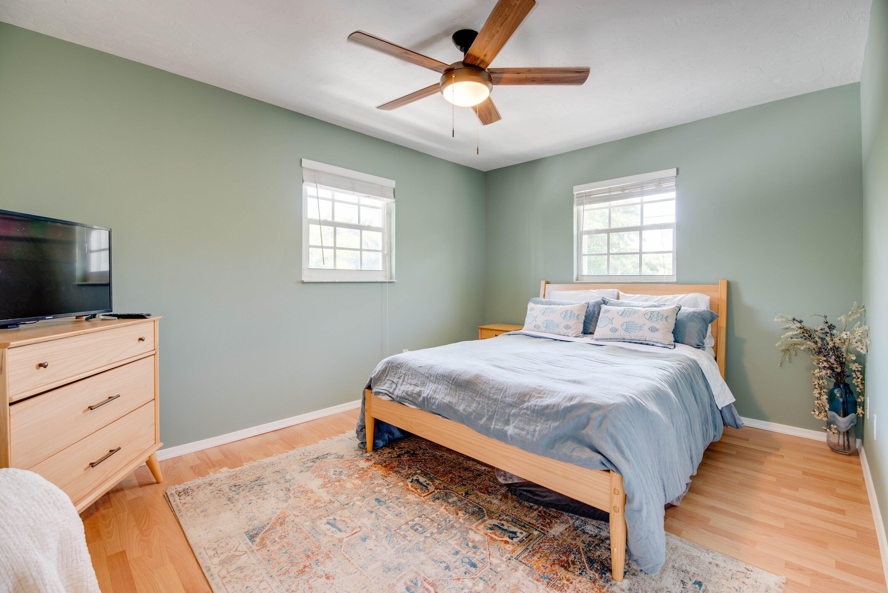 29160 Primrose Lane Big Pine Key, FL 33043 - Photo 15 of 37 a bedroom with a bed and a flat screen tv