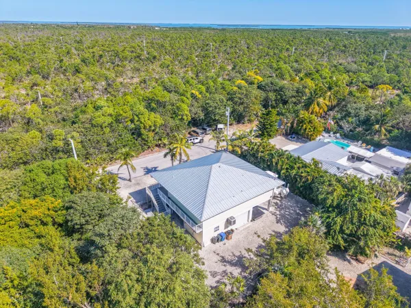 a aerial view of a house with a yard