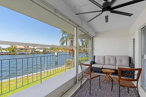 a view of a living room and a balcony