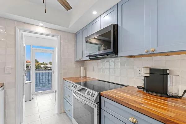 a kitchen with a stove and a microwave