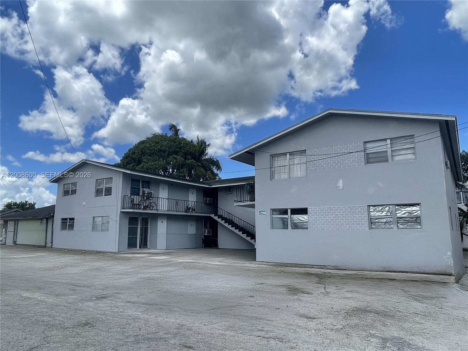 332 Southwest 3rd Street, Unit 2 Belle Glade, FL 33430 - Photo 7 of 7 a view of a house with a garage