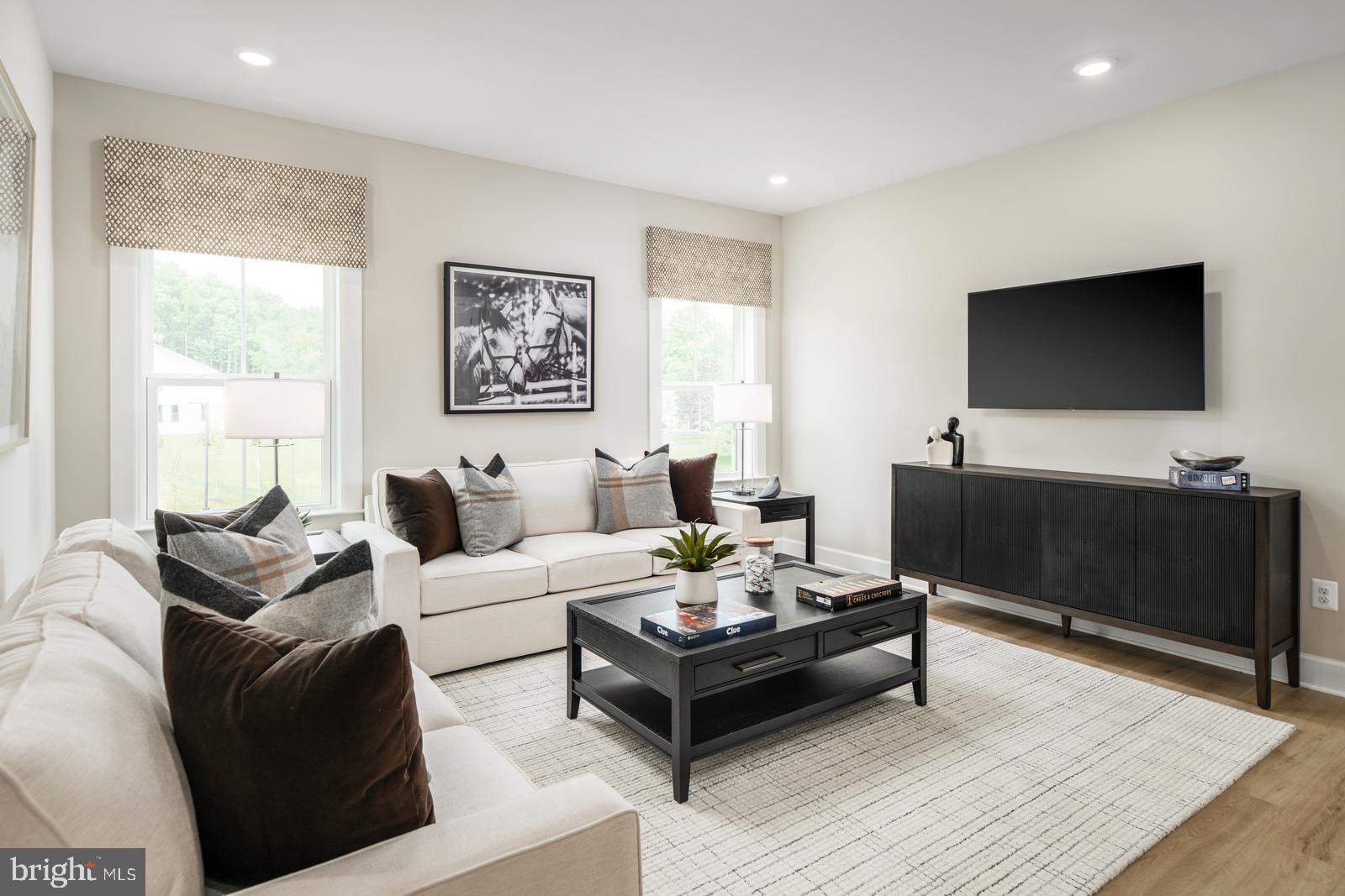 3187 Leopold Court Huntingdon Valley, PA 19006 - Photo 14 of 27 a living room with furniture and a flat screen tv