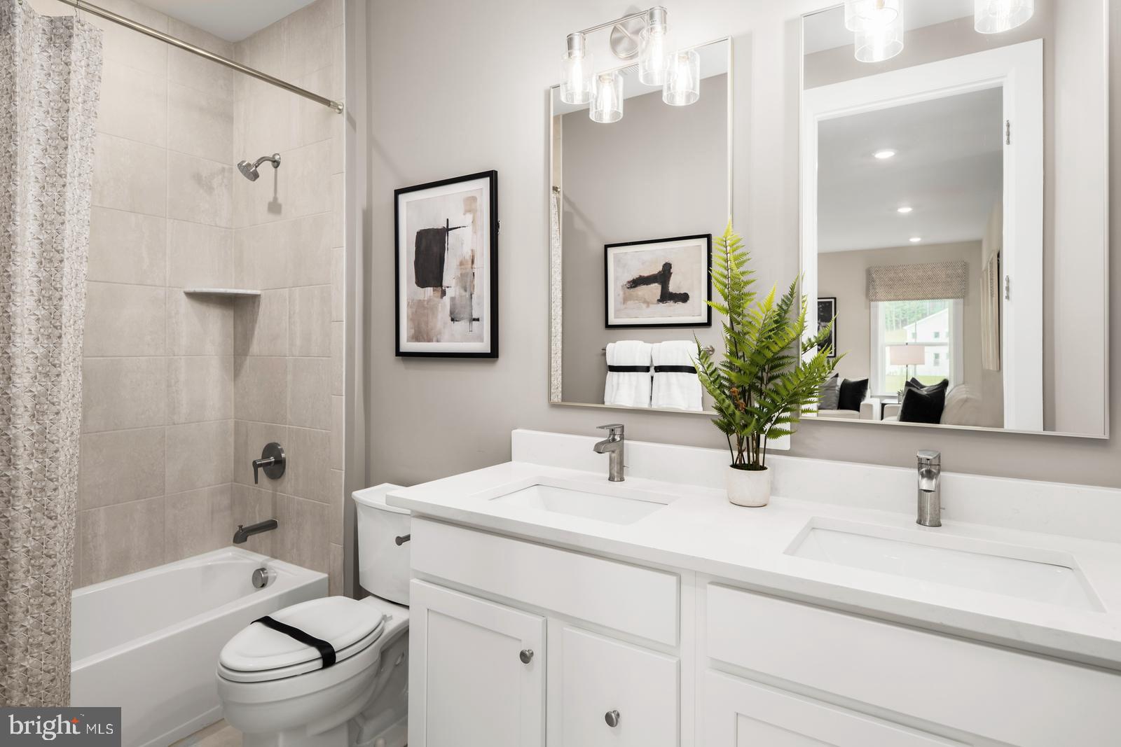 3187 Leopold Court Huntingdon Valley, PA 19006 - Photo 19 of 27 a bathroom with a sink a toilet a mirror a bathtub and shower