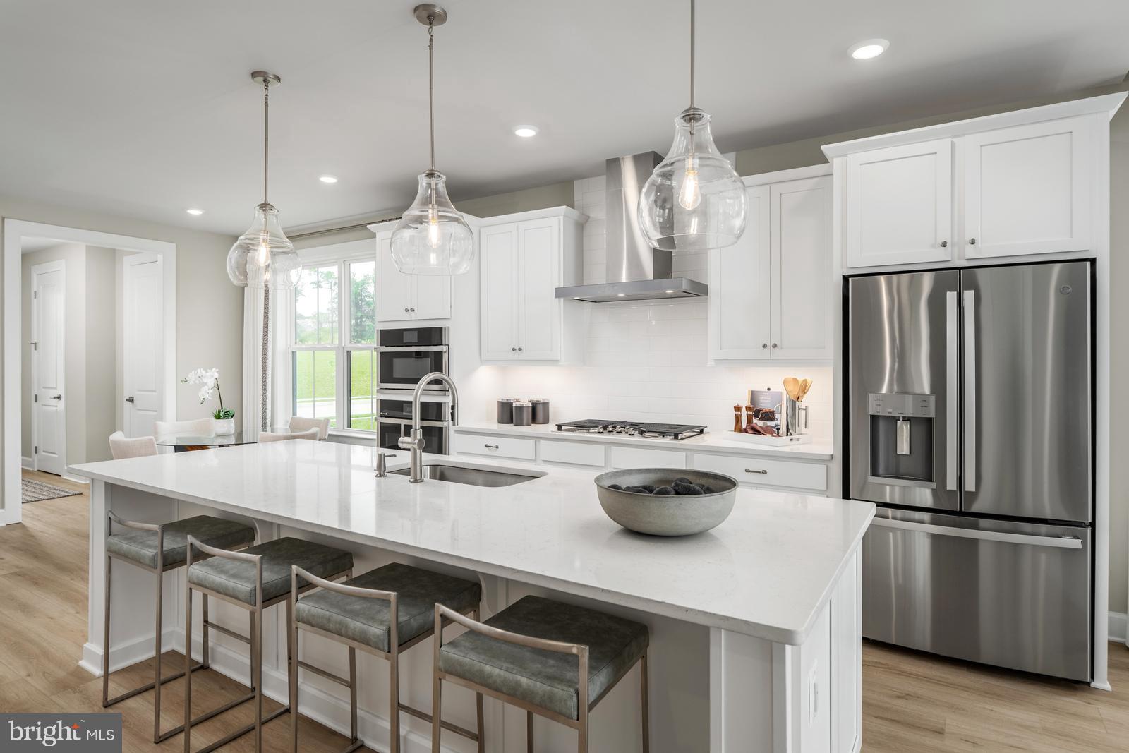 3187 Leopold Court Huntingdon Valley, PA 19006 - Photo 3 of 27 a kitchen with refrigerator cabinets and wooden floor