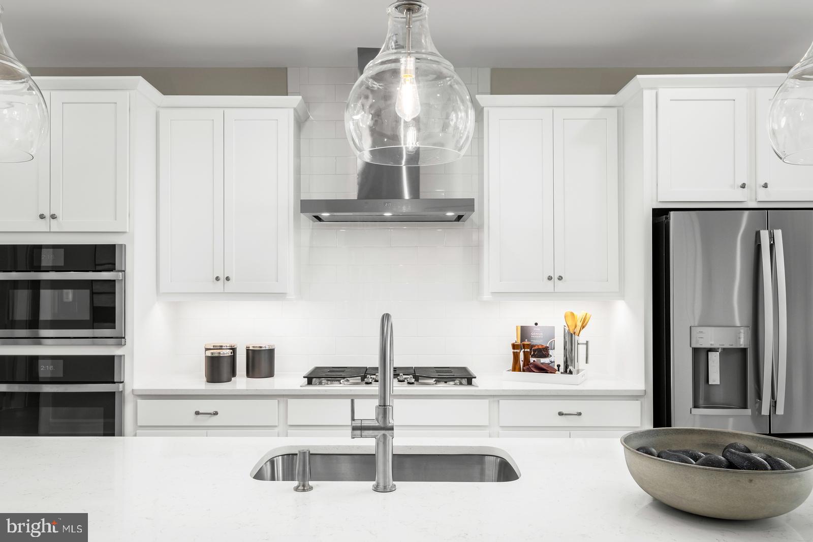 3187 Leopold Court Huntingdon Valley, PA 19006 - Photo 6 of 27 a kitchen with stainless steel appliances a sink a stove and white cabinets