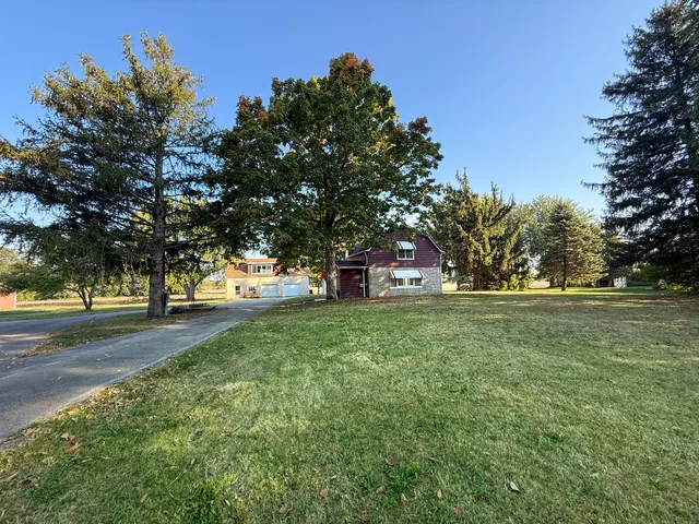 a view of a tree in front of a house