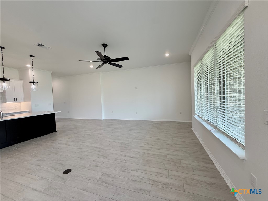 2016 Yarrow Road Temple, TX 76502 - Photo 11 of 30 a view of a room with a ceiling fan and wooden floor