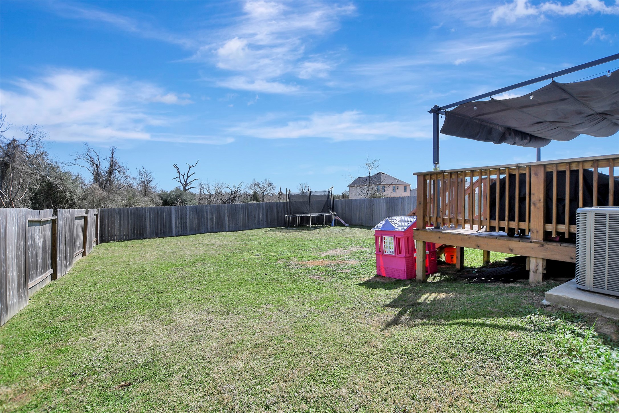950 21st Street Hempstead, TX 77445 - Photo 33 of 35 Privacy-fenced backyard situated on the first of two lots, offering secure space for pets, play, or outdoor enjoyment.
