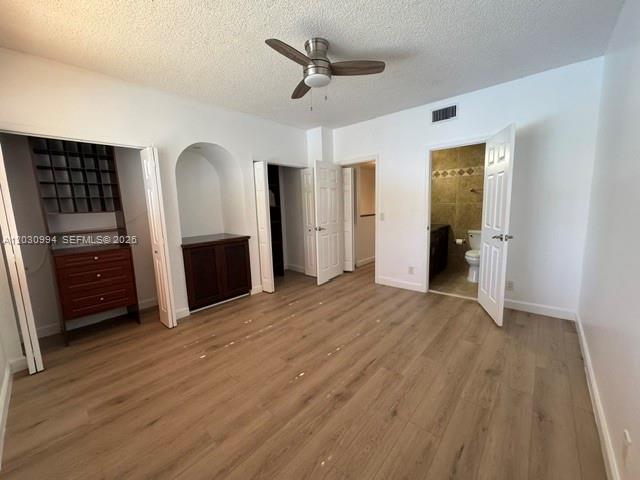 192 Southwest 96th Avenue, Unit 192 Plantation, FL 33324 - Photo 11 of 15 wooden floor in an empty room with a window