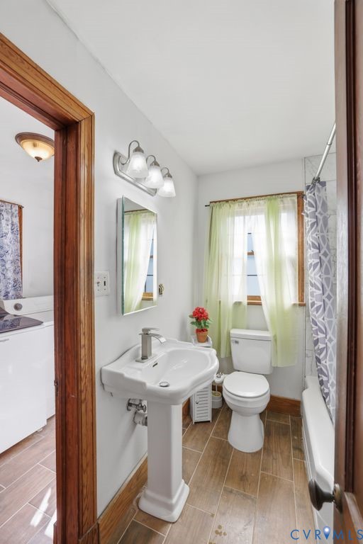 3200 Manorcrest Road Richmond, VA 23234 - Photo 21 of 34 a bathroom with a sink toilet a mirror and vanity