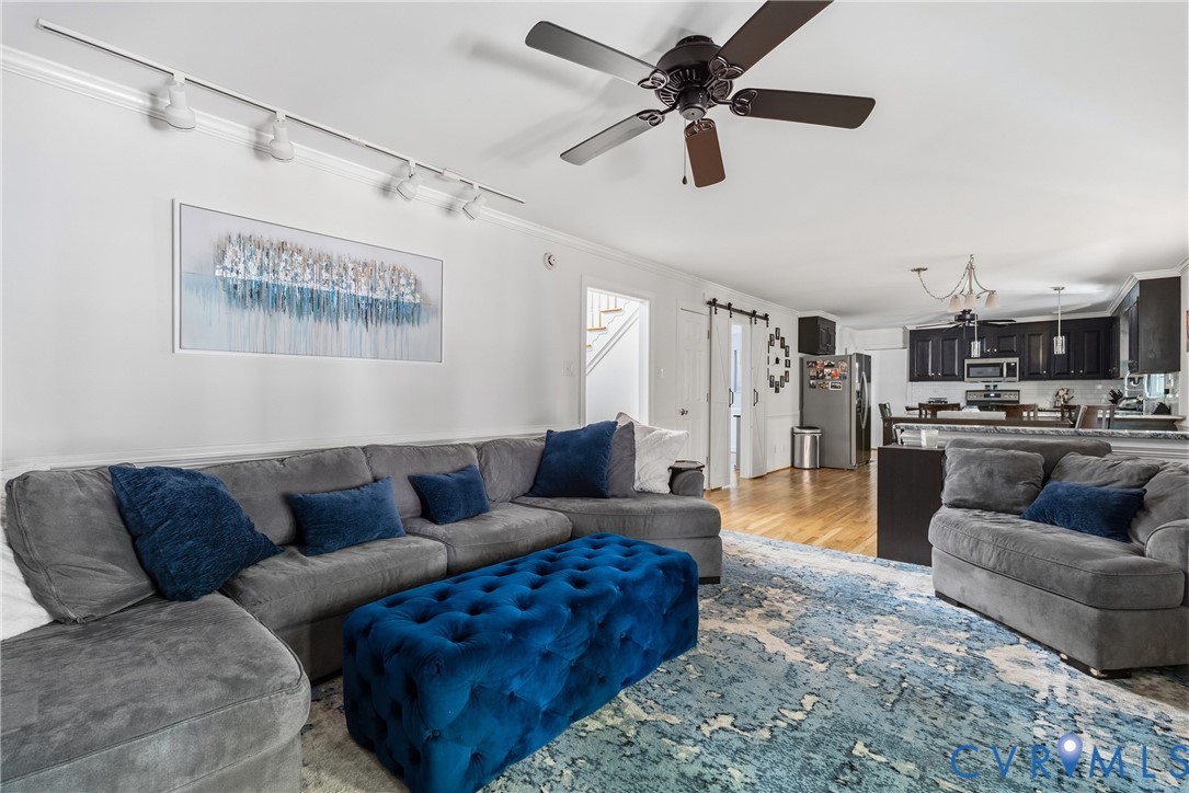14321 Crossings Ridge Drive Midlothian, VA 23113 - Photo 21 of 43 a living room with furniture and a ceiling fan